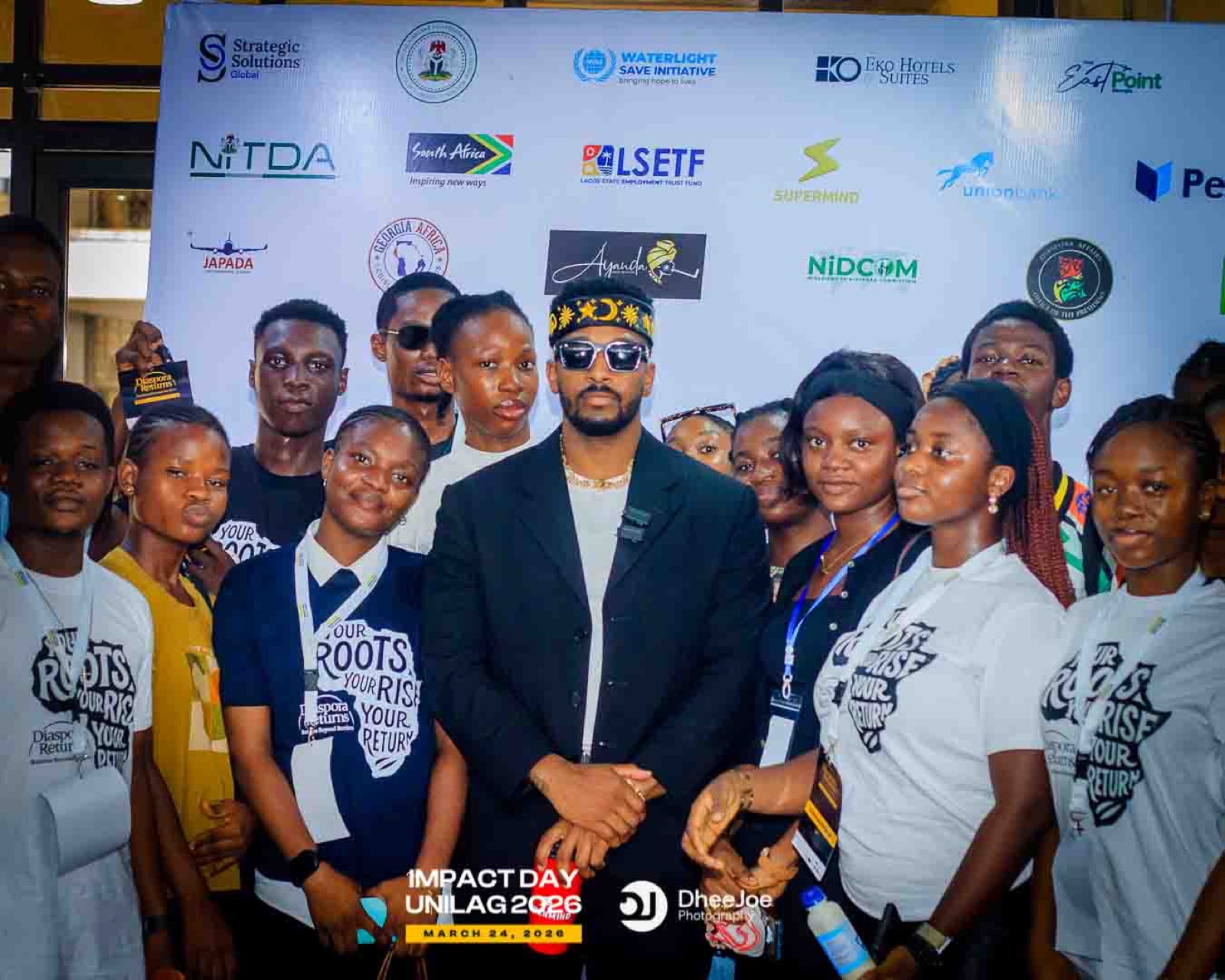 19Keys standing with community members after a Project High-Lvl event