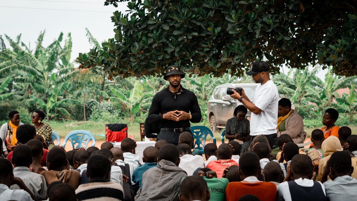 19Keys speaking with a community outdoors during a Project High-Lvl program